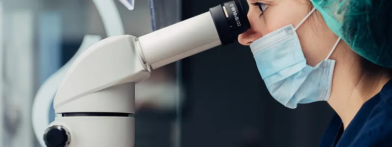 Woman looking in microscope